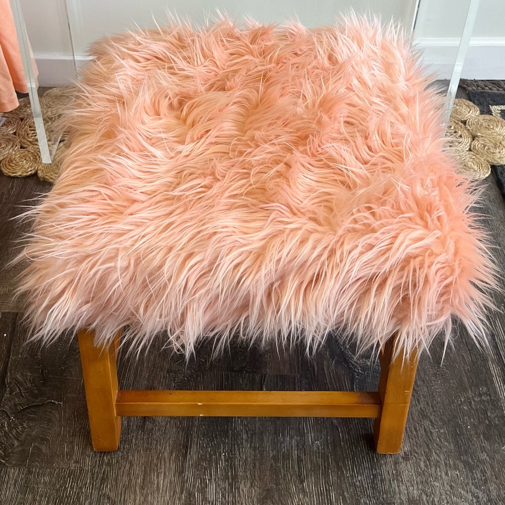 Coral pink faux fur bench